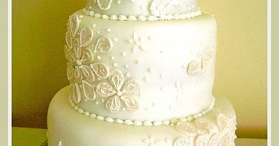 Vintage White Tiered wedding cake in a subtle lemon flavoured sponge with lemon curd and buttercream filling. Covered in white fondant and luster embossed petal and pipping decoration. I really enjoyed making this wedding cake, i wanted something timeless...
