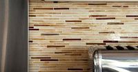 Translucent Tile Consisting of slender glass tile in creamy hues and stone tiles in coppery shades, the radiant translucence of this mosaic backsplash adds depth to the kitchen. A neutral color palette such as this one can warm up a sleek, contemporary sp...
